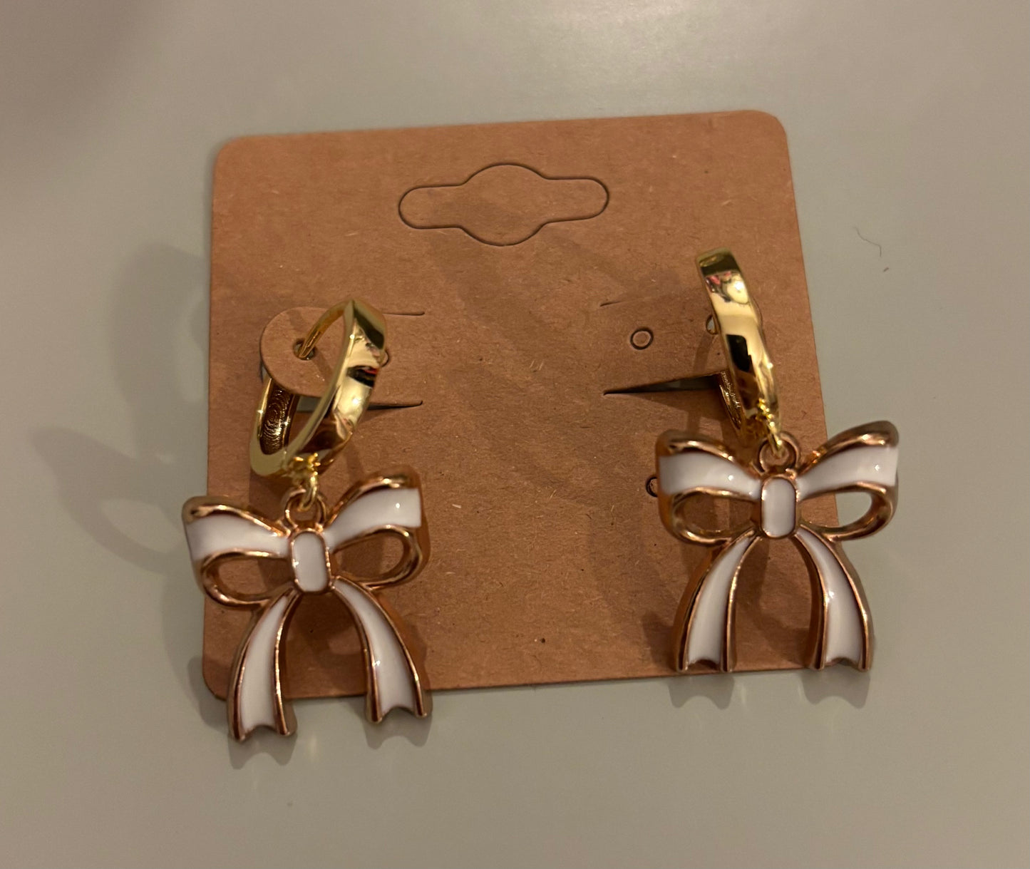 White bow earrings