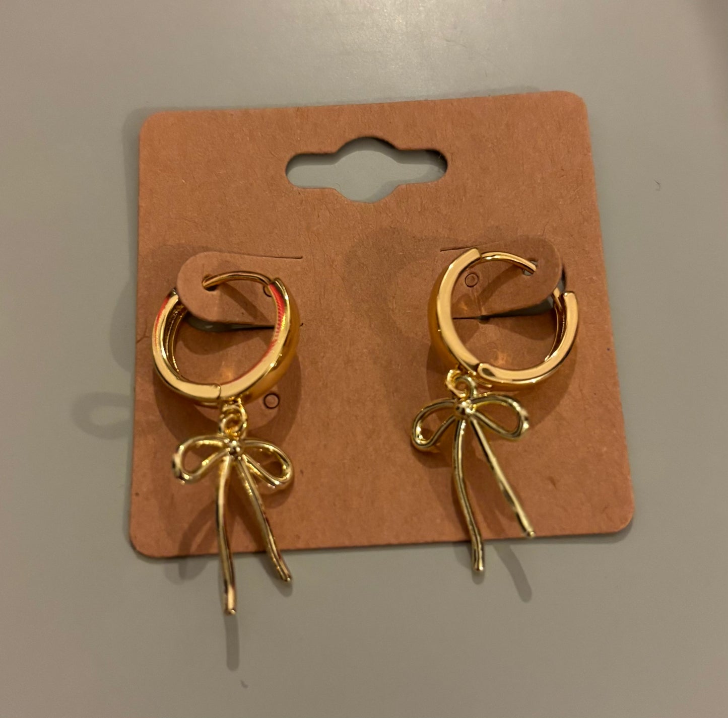 Skinny gold bow earrings